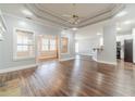 Open living area with hardwood floors connecting to the kitchen and breakfast nook at 217 Chad Ln, Loganville, GA 30052