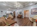 Open living area with hardwood floors, neutral paint, and seamless flow to the kitchen at 217 Chad Ln, Loganville, GA 30052