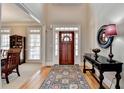 Elegant foyer with hardwood floors and a view into the formal dining area at 1683 Wheatstone Dr, Grayson, GA 30017