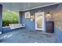 Cozy front porch features a swing, offering a relaxing spot to unwind and enjoy the outdoors at 259 14Th Ne St # 104, Atlanta, GA 30309