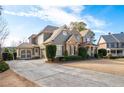 Beautiful two-story home with a two car garage and an expansive driveway and manicured lawn at 3309 Nw Past Nw Pl, Kennesaw, GA 30152