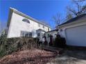 Exterior angle view of the home, featuring a partial view of the 2-car garage at 509 Arnold Rd, Lawrenceville, GA 30044