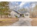 Ranch-style home featuring a two-car garage and concrete driveway at 5833 Westerling Pl, Powder Springs, GA 30127