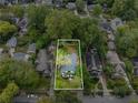 Bird's-eye view of a home with property lines, surrounded by trees and neighboring houses at 645 Cumberland Rd, Atlanta, GA 30306