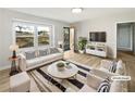 Bright living room with large windows and neutral decor, virtually staged at 773 Cone Rd, Forest Park, GA 30297