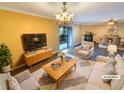 Bright living room featuring neutral tones, stylish furnishings, and a sliding glass door at 2064 Powers Ferry Se Trce, Marietta, GA 30067