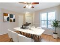 Bright dining room features wood floors, neutral paint and a window at 4676 Cedar Park Trl, Stone Mountain, GA 30083