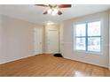 Inviting Living room with wood floors, neutral walls and a bright window at 4676 Cedar Park Trl, Stone Mountain, GA 30083