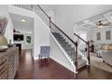 Grand two-story foyer with hardwood floors and staircase leading to the second floor living spaces at 48 Scenic Ovlk, Acworth, GA 30101