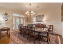 Formal dining room with wainscoting, hardwood floors, and elegant chandelier at 3631 Habersham Nw Rd, Atlanta, GA 30305