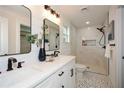 Modern bathroom featuring double sinks, a walk-in shower, and sleek fixtures at 960 Sharon Se Cir, Smyrna, GA 30080