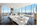 Bright and airy living room boasts floor-to-ceiling windows with city views at 3630 Peachtree Ne Rd # 3401, Atlanta, GA 30326