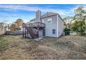 Spacious backyard featuring a wooden deck, stairs, and a fenced-in yard, ideal for outdoor activities at 5806 Highgrove Dr, Atlanta, GA 30349