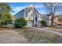 Well-maintained two-story home with classic design elements and a neatly landscaped front lawn at 5806 Highgrove Dr, Atlanta, GA 30349