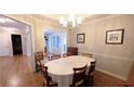 Formal dining room with hardwood floors, crown molding, and views to the foyer at 1104 Fox Ln, Woodstock, GA 30188