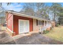 Lovely brick home features a side entrance, charming curb appeal and a paved driveway at 832 Virginia Se Ct, Conyers, GA 30094