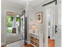 Bright foyer with hardwood floors, a stylish table, and views of the front porch through the open door at 167 Freyer Ne Dr, Marietta, GA 30060