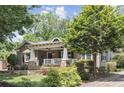 Beautiful front exterior view of a one-story home, featuring a welcoming porch and well-maintained landscaping at 167 Freyer Ne Dr, Marietta, GA 30060