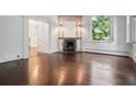 Elegant living room with a fireplace, hardwood floors, and abundant natural light at 33 Maddox Dr, Atlanta, GA 30309