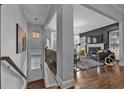 Inviting living room featuring hardwood floors, a fireplace, and abundant natural light at 2090 Callaway Nw Ct, Atlanta, GA 30318