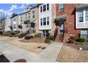 Townhouse exterior showing brick facade, front entrance, and minimal landscaping at 2569 Village Park Bnd, Duluth, GA 30096