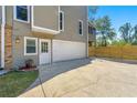 Attached two-car garage with door to backyard and driveway at 1031 Steeple Run, Lawrenceville, GA 30043