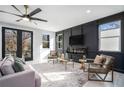 Stylish living room with a cozy fireplace, comfortable seating, and ample natural light at 676 S Grand Nw Ave, Atlanta, GA 30318