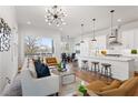 Bright and airy open-concept living area features hardwood floors, modern lighting, and seamless kitchen access at 965 Boulevard Se # A, Atlanta, GA 30312