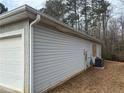 This home features vinyl siding and an outdoor HVAC unit at 40 Brandon Dr, Covington, GA 30016