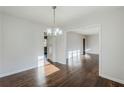 Dining room features modern chandelier, hardwood floors, and an open layout perfect for entertaining at 1722 Detroit Nw Ave, Atlanta, GA 30314