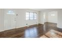 Bright living room featuring hardwood floors, neutral walls, and a large window for ample natural light at 1722 Detroit Nw Ave, Atlanta, GA 30314