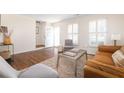 Inviting living room with hardwood floors, stylish decor, and ample natural light at 834 Heritage Sq, Decatur, GA 30033