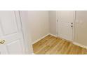 Bright entryway features wood flooring and a closet for easy storage solutions at 1198 Oak Knoll Ct, Lithonia, GA 30058