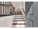 Inviting entryway features hardwood stairs and railing at 2177 Witton Way, Chamblee, GA 30341