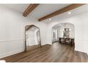 Elegant living room showcasing hardwood floors, and view into the dining area at 1323 Champion Run Dr, Dacula, GA 30019