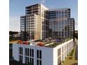 Modern high-rise condo building with a rooftop pool and outdoor amenity area at 2425 Peachtree Ne Rd # 810, Atlanta, GA 30305