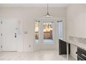 Bright breakfast nook with marble floors, bay windows, and a view of the front yard at 2983 Crosswycke Forest Ne Dr # A, Atlanta, GA 30319