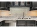 Modern kitchen featuring granite countertops, stainless steel appliances, and stylish cabinetry at 2983 Crosswycke Forest Ne Dr # A, Atlanta, GA 30319