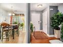 Welcoming entryway leading to a dining area, featuring hardwood and tile flooring at 338 Saratoga Pl, Riverdale, GA 30296
