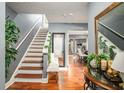 Inviting foyer with hardwood floors, staircase, and stylish decor at 338 Saratoga Pl, Riverdale, GA 30296