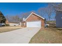 A two car garage provides additional parking and storage for this residential home at 983 Oakwood Chase Cir, Stone Mountain, GA 30083