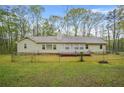 Fenced backyard with a ranch style home at 125 Bridget Dr, Hampton, GA 30228