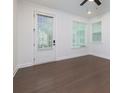 Bright bedroom features hardwood floors, natural light, and a private door to outdoor patio at 3785 Allegretto Cir # 230, Atlanta, GA 30339
