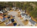 Aerial view of homes in a suburban cul-de-sac surrounded by mature trees and lush greenery at 2695 Virginia Cv, South Fulton, GA 30296