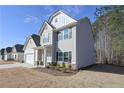 Beautiful two-story home with neutral siding, well-manicured lawn, and attached two-car garage at 455 Charleston Pl, Villa Rica, GA 30180