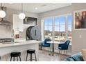 Modern kitchen featuring white cabinets, stainless appliances, island and separate eat in table at 22 Airline Ne St # 403, Atlanta, GA 30312