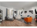 Bright living room featuring hardwood floors, unique artwork, and modern furniture at 383 Grant Se Cir # 1634, Atlanta, GA 30315