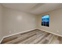 Cozy bedroom featuring hardwood floors, a window, and neutral paint, ready for personalization at 640 City Park Dr, Mcdonough, GA 30252