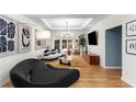 Bright living room featuring hardwood floors, modern lighting, and contemporary decor at 2861 Dorby Close Ne, Brookhaven, GA 30319