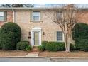 Lovely brick townhome with tidy landscaping, front entrance and symmetrical façade at 1659 Executive Park Ne Ln, Brookhaven, GA 30329